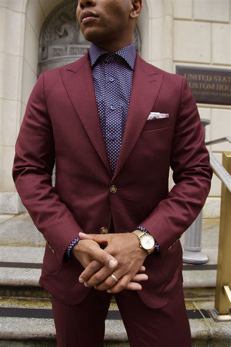 navy suit with burgundy shirt.